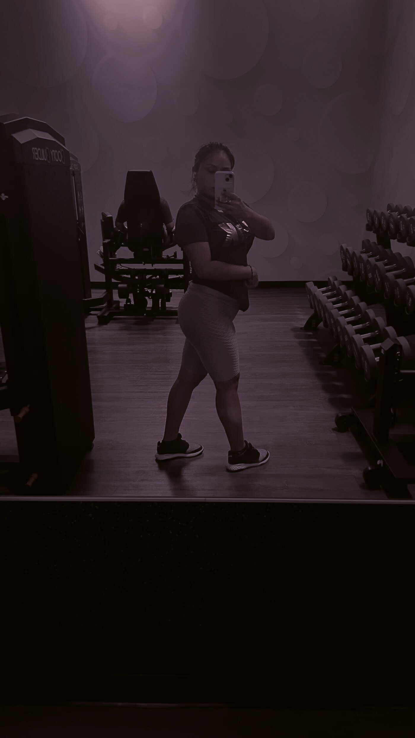Brigette Rodriguez training on the gym floor at night